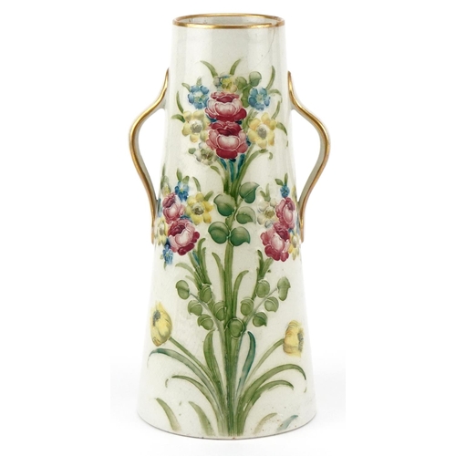 142 - A William Moorcroft for Macintyre & Co., Burslem England two handled vase with hand painted floral d... 