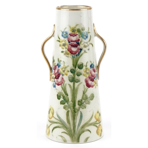  A William Moorcroft for Macintyre & Co., Burslem England two handled vase with hand painted floral d... 