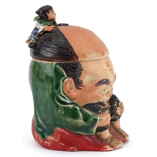 372 - A Japanese Sumida-Gawa porcelain tobacco jar and cover, Meiji period, modelled as a crouching man wi... 