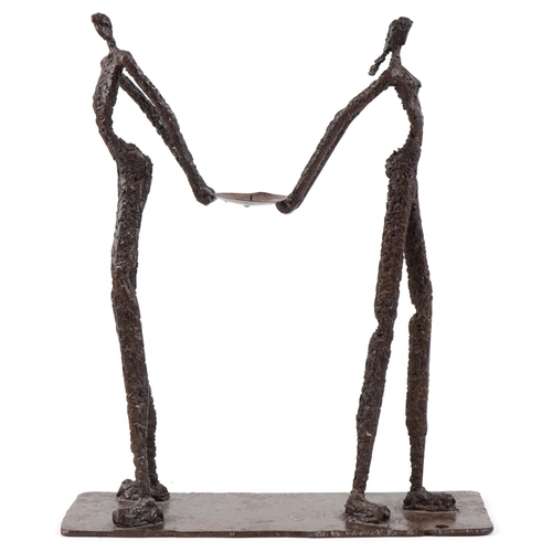 4 - A late 20th century bronze sculpture of an elongated man and woman on a rectangular base, indistinct... 