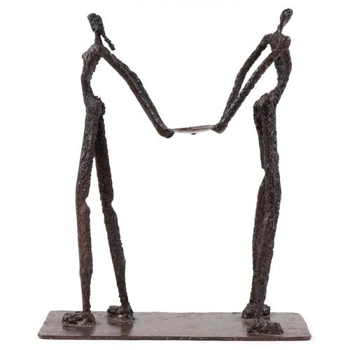 4 - A late 20th century bronze sculpture of an elongated man and woman on a rectangular base, indistinct... 