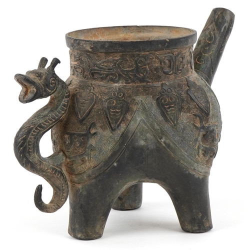 1601 - A Chinese archaistic bronze water pourer, 19th/20th century, with incised decoration and dragon hand... 