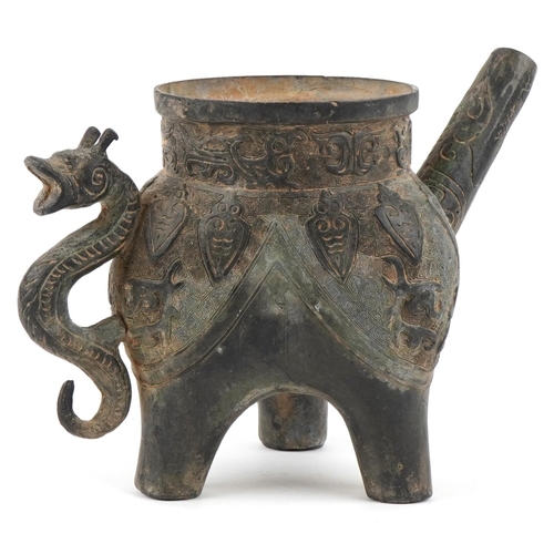 1601 - A Chinese archaistic bronze water pourer, 19th/20th century, with incised decoration and dragon hand... 