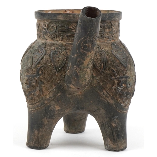 1601 - A Chinese archaistic bronze water pourer, 19th/20th century, with incised decoration and dragon hand... 