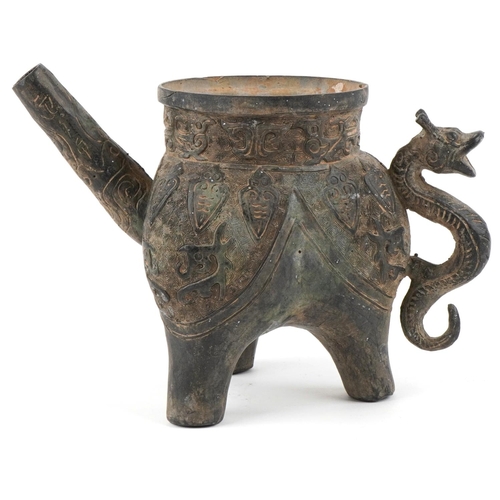 1601 - A Chinese archaistic bronze water pourer, 19th/20th century, with incised decoration and dragon hand... 