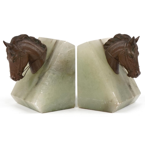 1625 - A pair of green onyx and bronze design horsehead bookends, 11cm high.