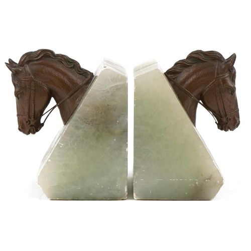 1625 - A pair of green onyx and bronze design horsehead bookends, 11cm high.