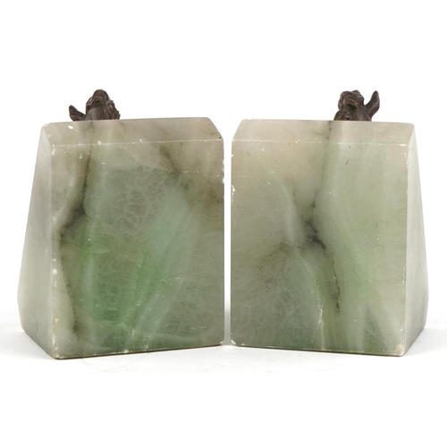 1625 - A pair of green onyx and bronze design horsehead bookends, 11cm high.