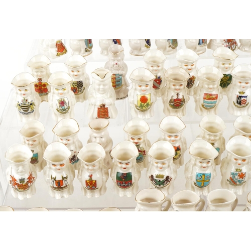 2520 - An extensive collection of crested china Toby jugs, approximately one hundred and eighty in total, i... 