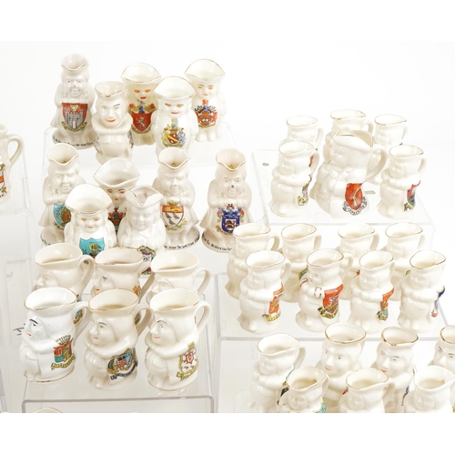 2520 - An extensive collection of crested china Toby jugs, approximately one hundred and eighty in total, i... 