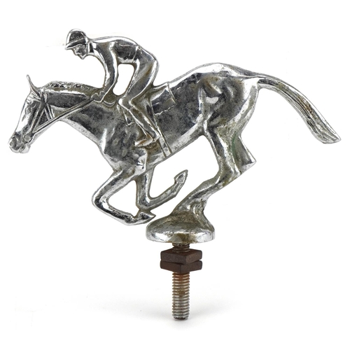 1387 - A vintage chrome plated car mascot in the form of a jockey on horseback, possibly Desmo, 17cm in len... 