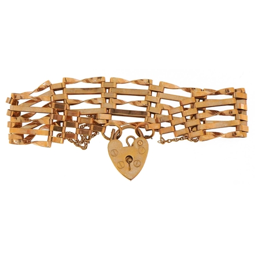 A 9ct gold five row gate bracelet with love heart padlock clasp, 16cm in length, 9.5g.