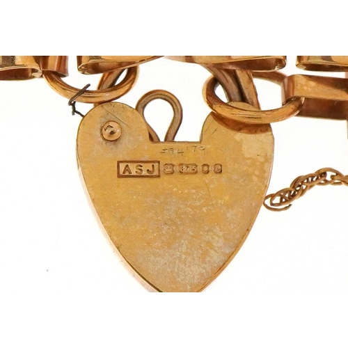 3003 - A 9ct gold five row gate bracelet with love heart padlock clasp, 16cm in length, 9.5g.