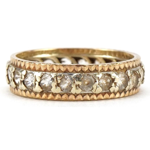 3055 - A 9ct two tone gold eternity ring set with clear stones, size P/Q, 3.8g.