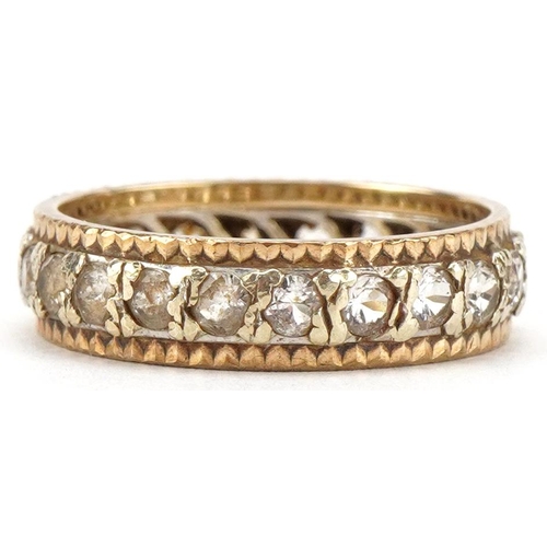 3055 - A 9ct two tone gold eternity ring set with clear stones, size P/Q, 3.8g.