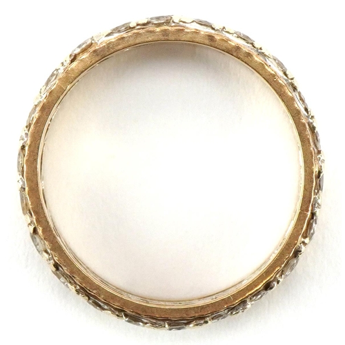 3055 - A 9ct two tone gold eternity ring set with clear stones, size P/Q, 3.8g.