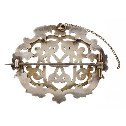 An unmarked silver and enamel monogram brooch, 6cm wide, 36.2g, housed ...
