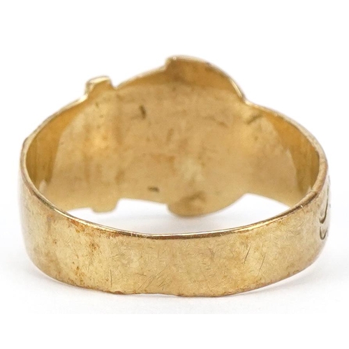 3013 - A 9ct gold floral engraved buckle ring, size U/V, 3.8g.