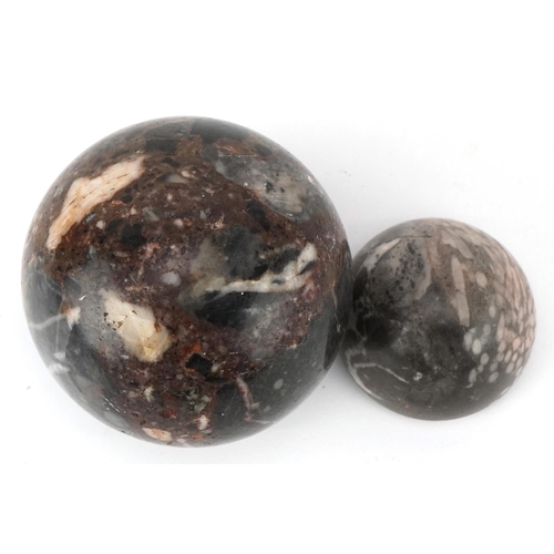 388 - A 20th century reconstituted marble ball, 9cm, together with another piece of polished marble, 6cm i... 