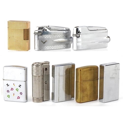 2623 - Eight vintage and later pocket lighters including a gold plated S T Dupont, Zippo and Calibre.