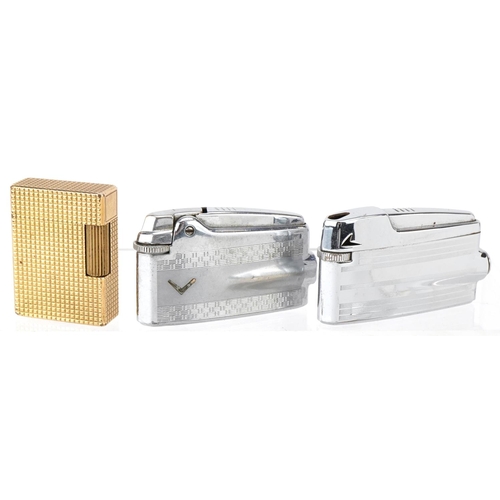 2623 - Eight vintage and later pocket lighters including a gold plated S T Dupont, Zippo and Calibre.