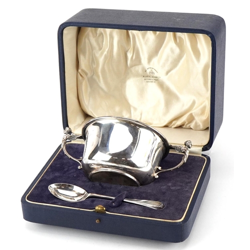 559 - Mappin & Webb, a George V silver bowl and spoon with angel design handles, Sheffield 1930, 15cm wide... 