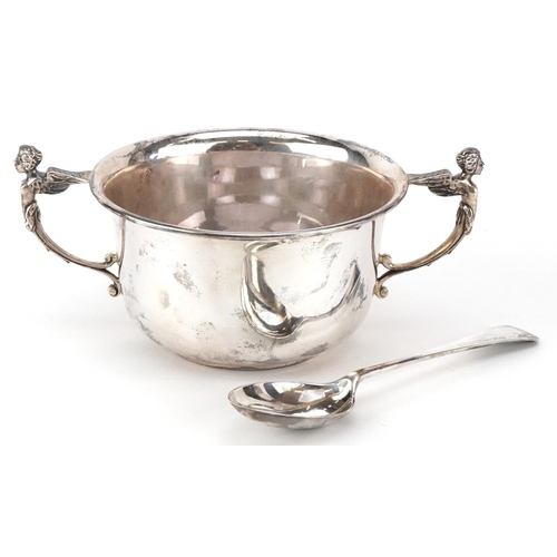 559 - Mappin & Webb, a George V silver bowl and spoon with angel design handles, Sheffield 1930, 15cm wide... 