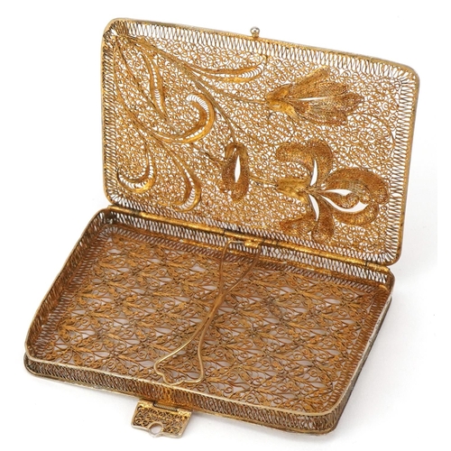 577 - A 19th century silver gilt filigree card case decorated with irises, 9cm high, 45.7g.