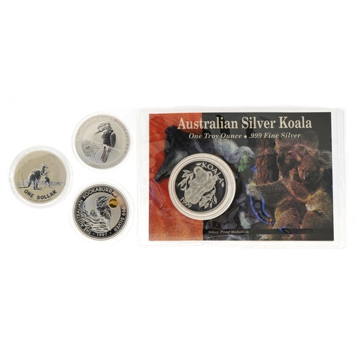 1289 - Four Australian one ounce fine silver one dollar coins and a medallion including 1997 one dollar Koo... 