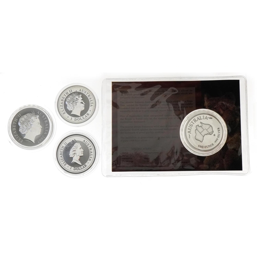 1289 - Four Australian one ounce fine silver one dollar coins and a medallion including 1997 one dollar Koo... 