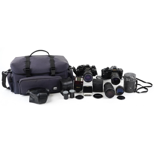 1012A - A Olympus OM10 camera body together with a Hoya 62mm lens, a Canon zoom lens 75-200mm, a Canon T70 c... 