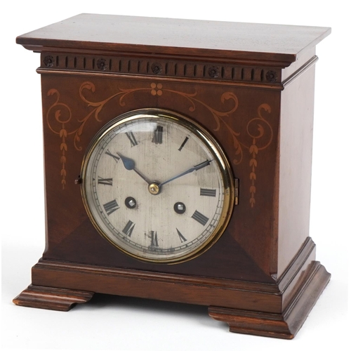 200 - A late Victorian mahogany cased mantle clock with inlaid decoration, the circular silvered dial with... 