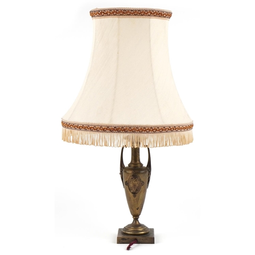 350 - A 20th century Art Nouveau style brass table lamp base decorated with classical masks, raised on a p... 