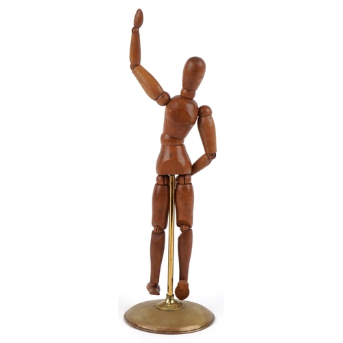 349 - A vintage French artist's articulated mannequin mounted on a circular brass stand, 32cm high.