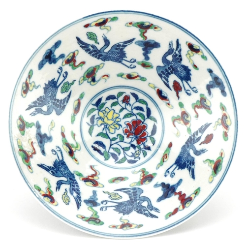 116 - A 20th century Chinese porcelain footed bowl hand painted with phoenixes amongst clouds, six figure ... 