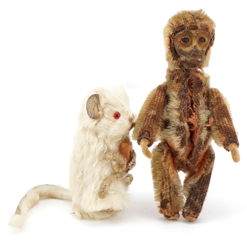 1087 - A miniature articulated monkey, possibly Schuco, together with a similar mouse, the largest 8cm high... 