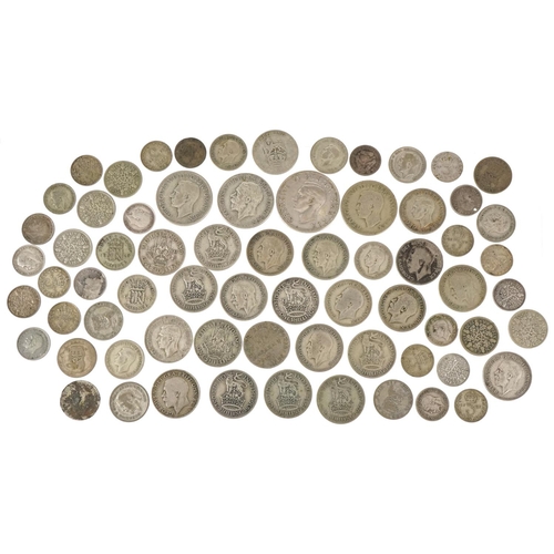 1248 - A quantity of British pre 1947 silver coinage to include threepences, sixpences, shillings, florins ... 