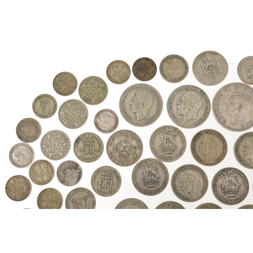 1248 - A quantity of British pre 1947 silver coinage to include threepences, sixpences, shillings, florins ... 