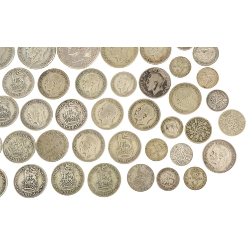 1248 - A quantity of British pre 1947 silver coinage to include threepences, sixpences, shillings, florins ... 