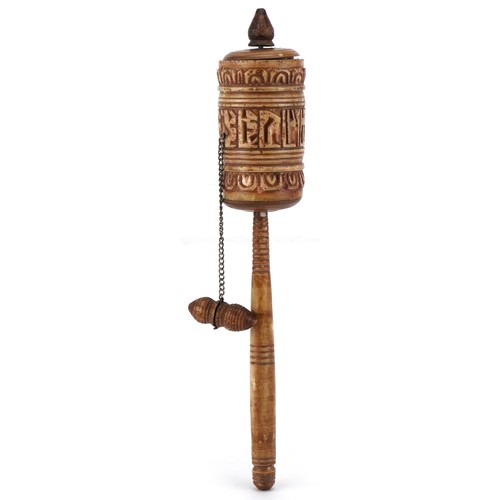 1592 - A Middle Eastern carved yak bone prayer wheel, 19cm in length.