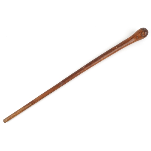 395 - An Australian Aboriginal throwing stick, 86cm in length.