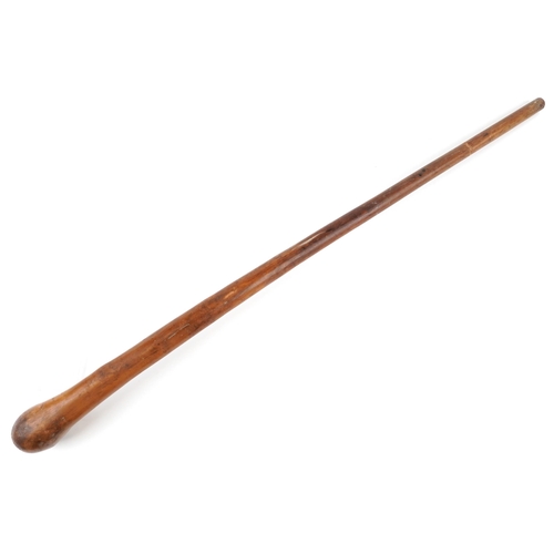 395 - An Australian Aboriginal throwing stick, 86cm in length.