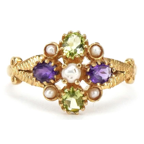 Of Suffragette interest, an antique style silver gilt multi gem ring set with seed pearls, peridot and amethyst, size M/N, 2.4g.