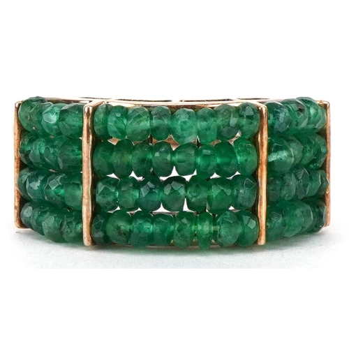 3554 - A 9ct gold emerald four row dress ring, size Q, 6.7g.