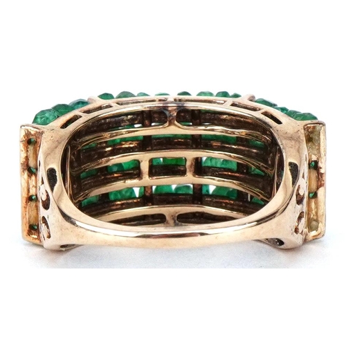 3554 - A 9ct gold emerald four row dress ring, size Q, 6.7g.