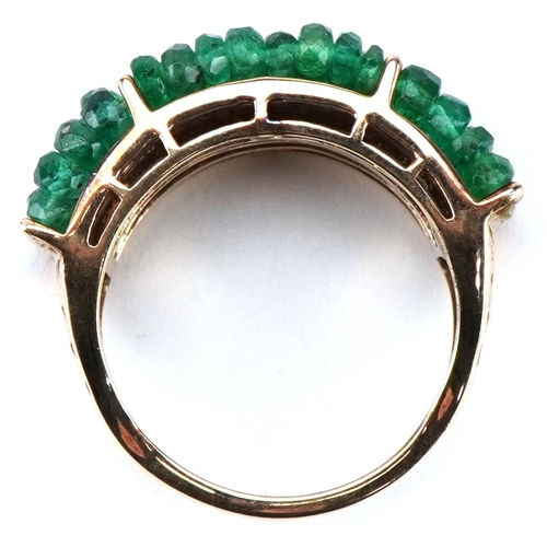 3554 - A 9ct gold emerald four row dress ring, size Q, 6.7g.