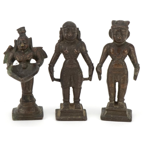 411 - Three 20th century Indian cast bronze statues of deities, the largest 11cm high.