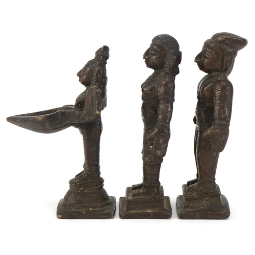 411 - Three 20th century Indian cast bronze statues of deities, the largest 11cm high.