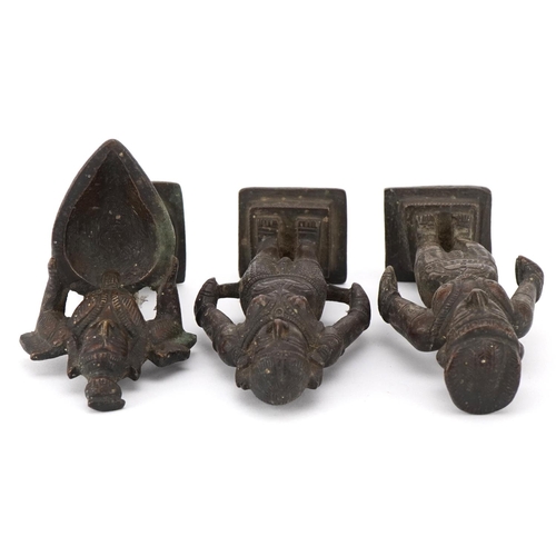 411 - Three 20th century Indian cast bronze statues of deities, the largest 11cm high.