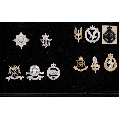 1490 - A collection of military interest cap badges including Royal Hussars, Waterloo Royal Scots Dragoon G... 